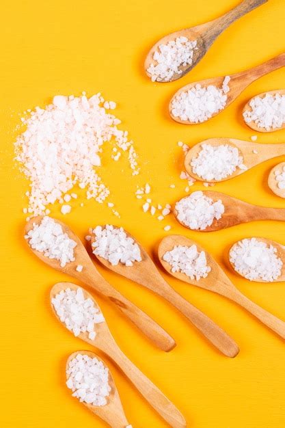 Free Photo Sea Salt In Wooden Spoons And Bowl