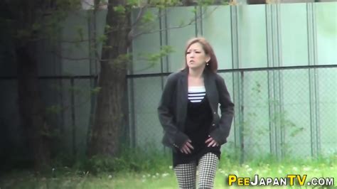 Japanese Babe Pisses On The Street