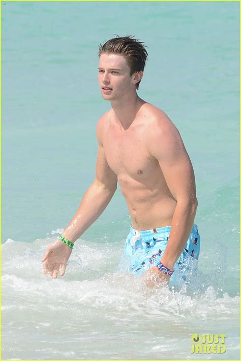 Patrick Schwarzenegger Shirtless Beach Football Photo