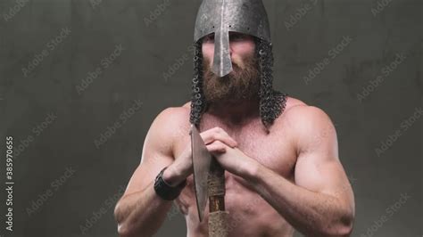 Scandinavian Stationary Barbarian With Naked Torso And Muscular Build