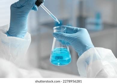 Scientist Dripping Liquid Pipette Into Beaker Stock Photo 2278956281