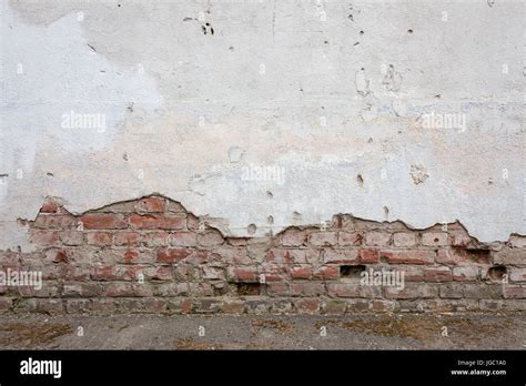 Aged Brick Wall With Cracked Plaster Stock Photo Alamy