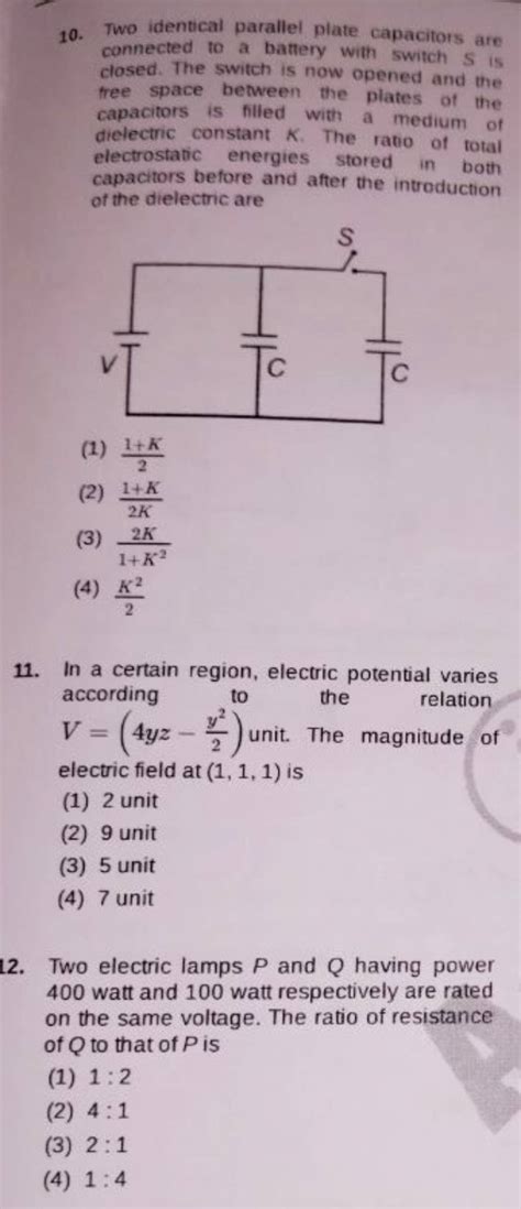 Two Identical Parallel Plate Capacitors Are Connected To A Battery With S