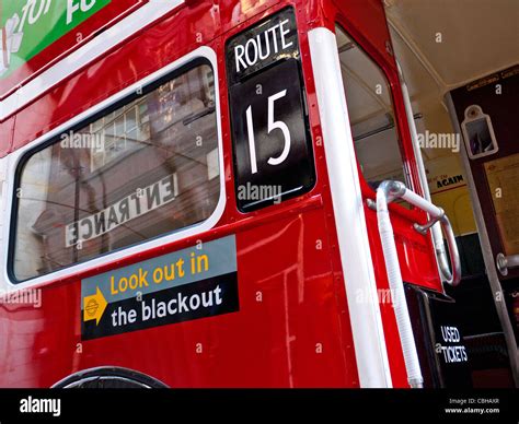 Restored Historic Traditional Red London Bus With Ww2 Poster Look