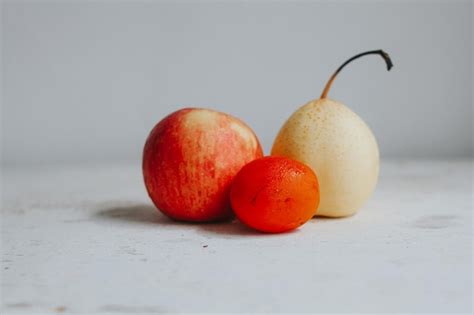 Premium Photo Red Apple Pear And Tomato Fruit Bcakground