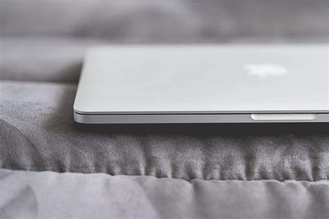 Closed Macbook Laptop On A Sofa Free Stock Photo Picjumbo