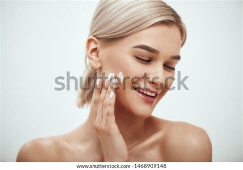 Portrait Cute Blonde Woman Spreading Cream Stock Photo