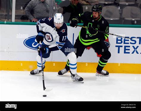 Winnipeg Jets Center Adam Lowry And Dallas Stars Left Wing Jamie