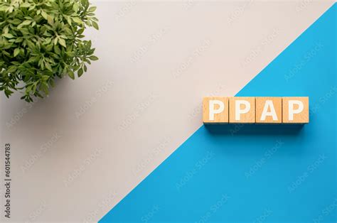 There Is Wood Cube With The Word PPAP It Is An Abbreviation For PPAP