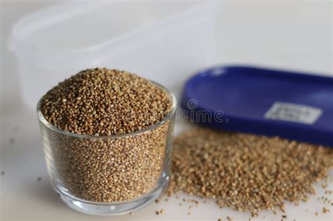 Pearl Millet Grains In A Storage Container And Glass Bowl Filled To The