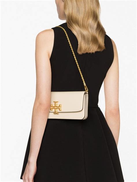 Tory Burch Eleanor Leather Clutch Bag In Beige Modesens