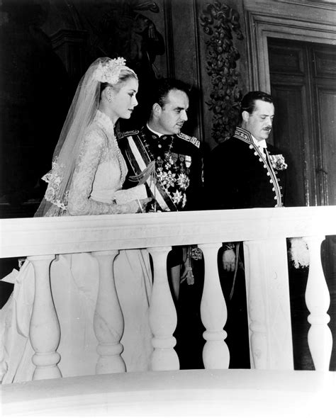 An Old Black And White Photo Of A Bride And Groom Standing On The