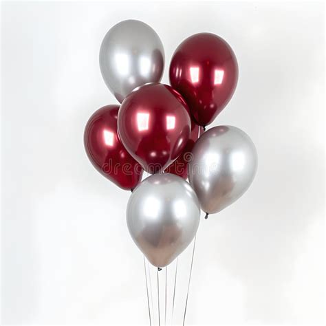 Celebration And Joy Concept With Red And Silver Balloons On A Light