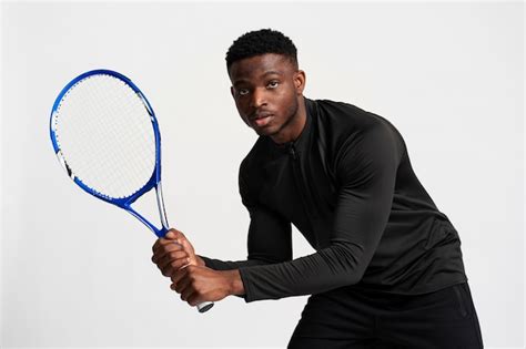 Premium Photo Medium Shot Man Holding Tennis Racket