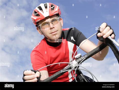 Racing cyclist wearing a safety helmet Stock Photo - Alamy