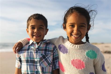 Premium Photo Portrait Of Smiling Biracial Girl Standing With Arm