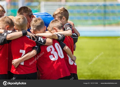 Children sports soccer team. Kids standing together on the football ...