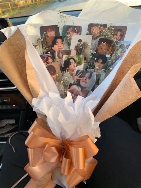 A Bunch Of Pictures Are Wrapped In Brown Paper And Tied To A Car