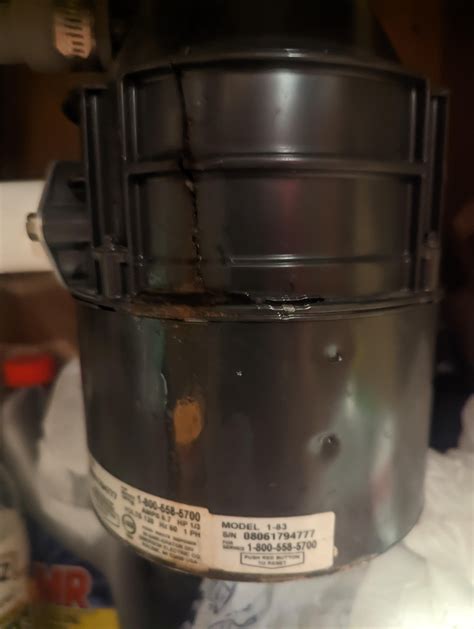 garbage disposal is cracked and leaking water. can I fix it or replace