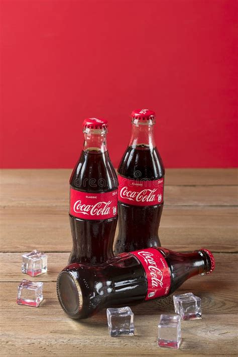 Coca-Cola Bottle With Ice Cubes On Wooden Background. Editorial Stock ...