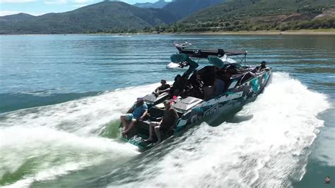 Luxury Power Boat Challenged By Navy Patrol Boat In A Wake Wave Contest