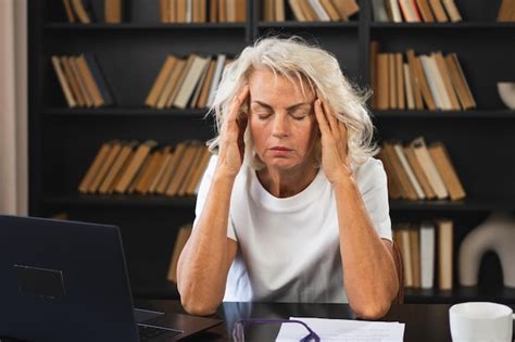Premium Photo Headache Pain Middle Aged Woman Touching Temples Experiencing Stress Mature Old