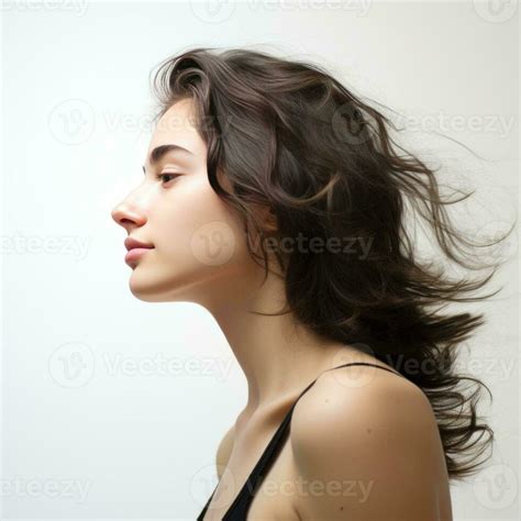 side view of girl face with black messy hairs on white background ...