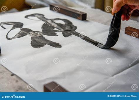 An Old Chinese Calligrapher Is Writing Brush Characters Creating