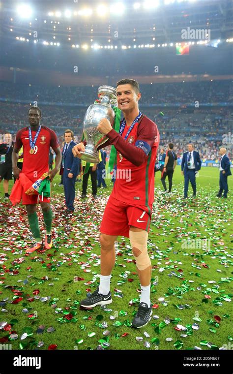 portugals cristiano ronaldo celebrates   trophy   pitch