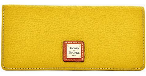 Dooney Bourke Pebble Grain Slim Wallet In Yellow Lyst