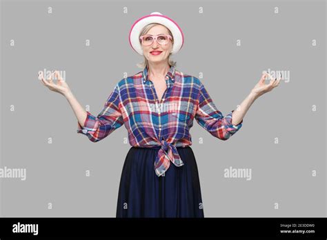 Portrait Of Calm Modern Stylish Mature Woman In Casual Style With Hat