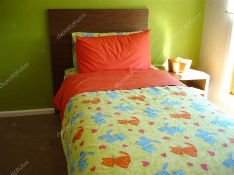 Bright green and orange cheerful bedroom — Stock Photo © scarfe #6502101