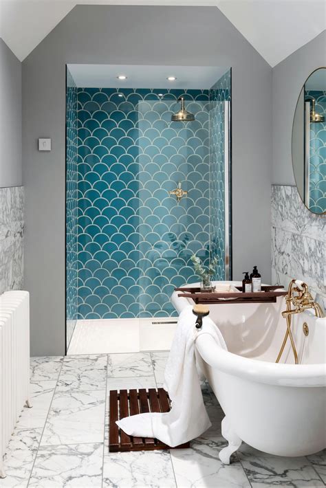 Incorporating A Statement Blue Tile Into This Stylish En Suite Gives It