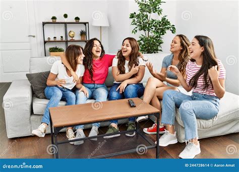 Group Of Young Women Friends Smiling Happy Sitting On The Sofa At Home