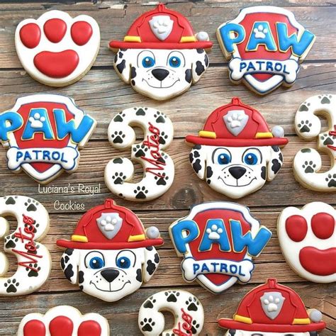 Paw Patrol Cookies Are Arranged On A Wooden Table