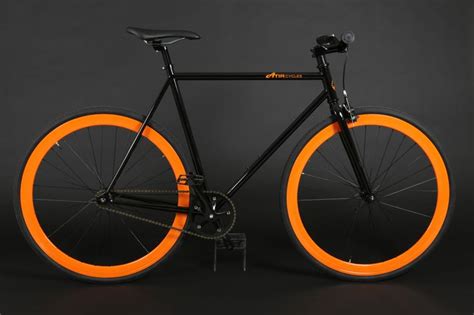 A Black And Orange Bike With An Orange Spokes On The Front Wheel