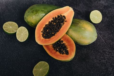 Photo Of Papaya Beside Sliced Lime · Free Stock Photo