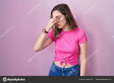 Blonde Caucasian Woman Standing Pink Background Tired Rubbing Nose Eyes Stock Photo