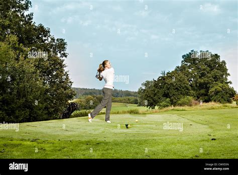 Female Golf Player With A Golf Club Stock Photo Alamy