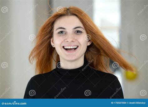 Close Up Portrait Of Pretty Redhead Girl With Long Wavy Hair Blowing On