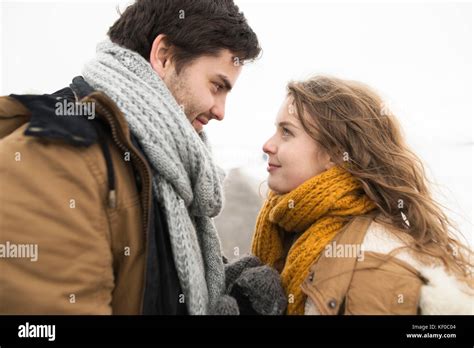 Young couple in love face to face in winter Stock Photo - Alamy