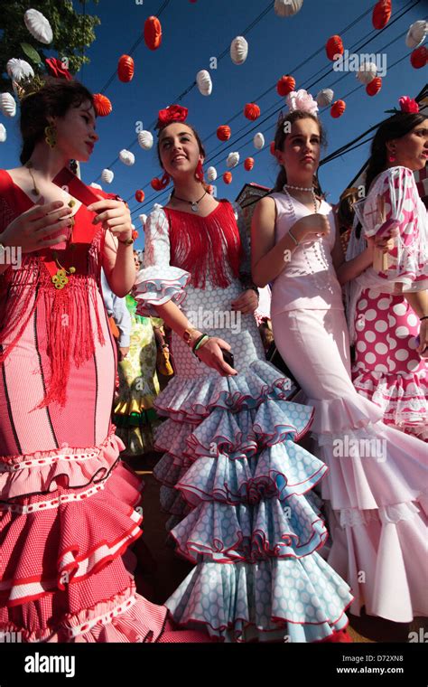 Girls Wearing Flamenco Dresses At The Feria De Abril Seville Spain