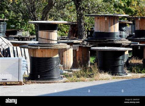 Thick Black Electrical Cable On Various Sizes Industrial Wooden Cable