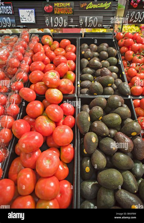 Inside Of An American Grocery Store Displaying Red Ripe Tomatoes And