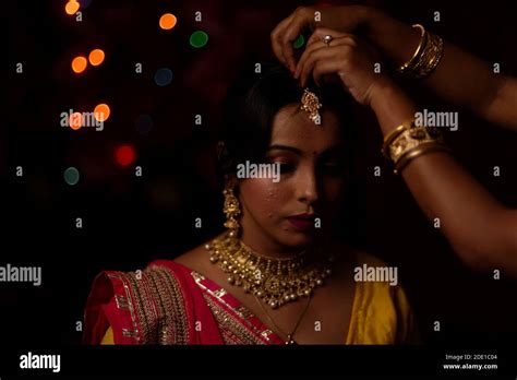 Portrait Of An Indian Bengali Beautiful Brunette Woman In Front Of The Colorful Light Bokeh