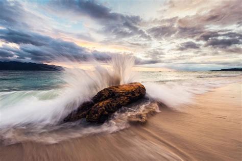 Turquoise Creative Beautifully Shot Of Waves Crashing Into A Rock