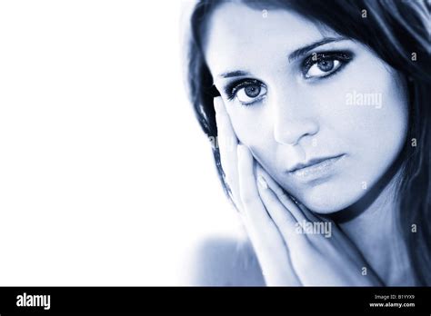 Woman Holding Her Hands At The Side Of Her Face Stock Photo Alamy