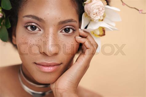 Portrait Of Half Naked African American Woman With Flowers In Her Hair