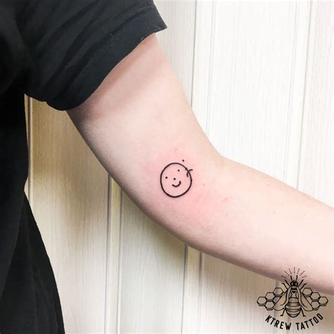 sad happy face tattoo