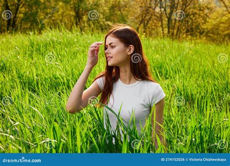 Cute Happy Carefree Woman Sitting In Tall Grass Stock Photo Image